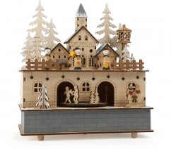 Drewniana skrzynka do zabawy z małymi stopami i światłem zimowej wioski